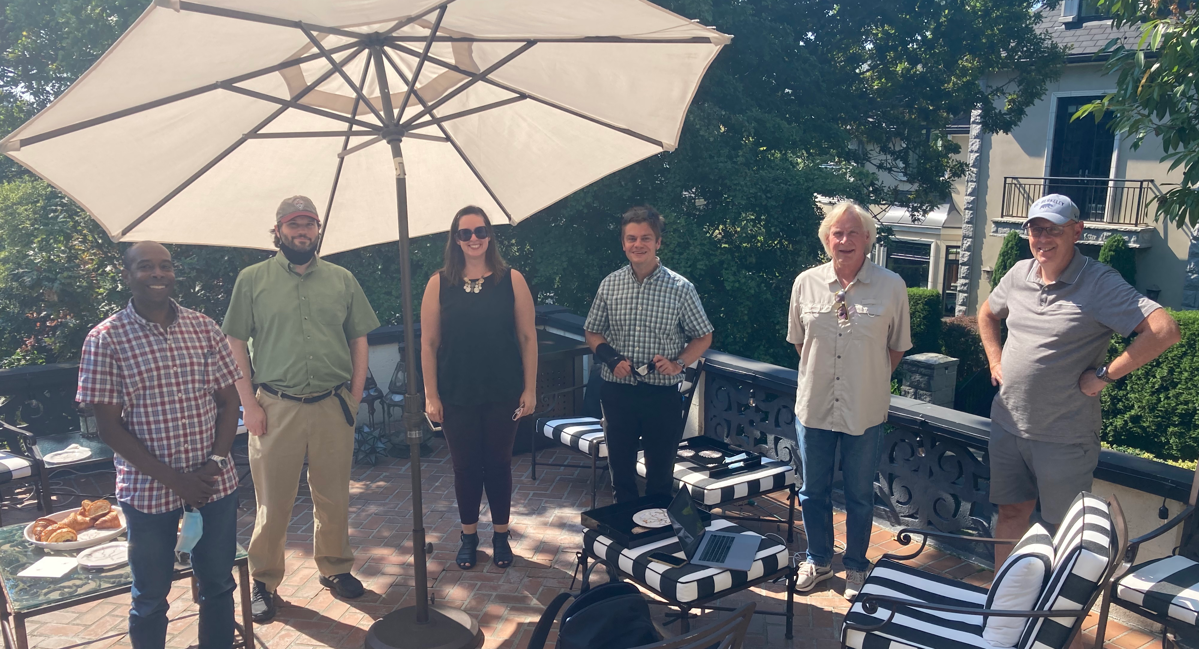 The entire team at Gerard's house on his patio outside: Delwin, Scott, Stephanie, Lewis, Paul, and Gerard