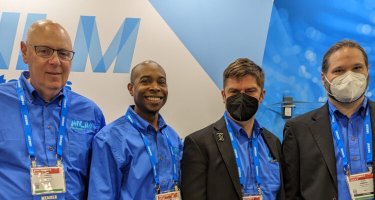 Gerard, Delwin, Lewis, and Scott in front of the NLM booth during Photonics West 2023