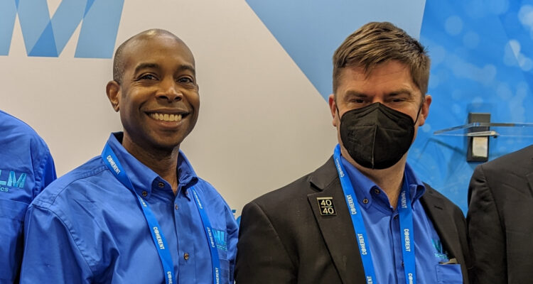 Delwin and Lewis at Photonics West in their blue NLM shirts
