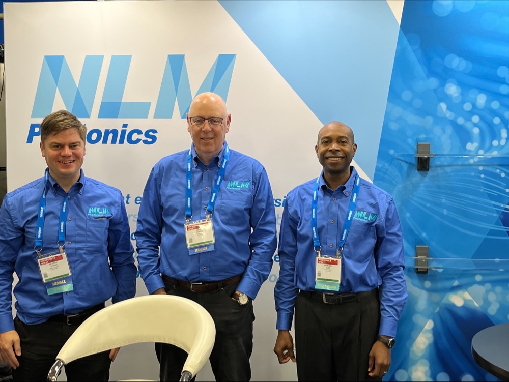 Dr. Lewis E. Johnson, Gerard Zytnicki, and Dr. Delwin L. Elder in front of our Photonics West booth on opening morning.