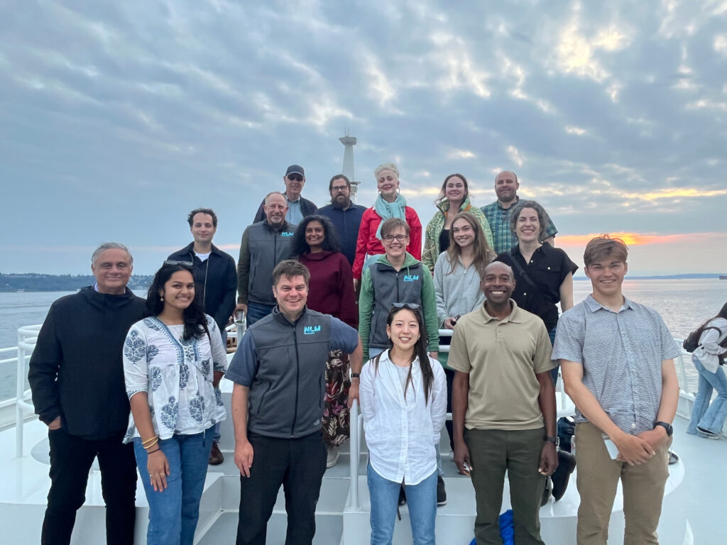 The NLM team on a boat in the Puget Sound